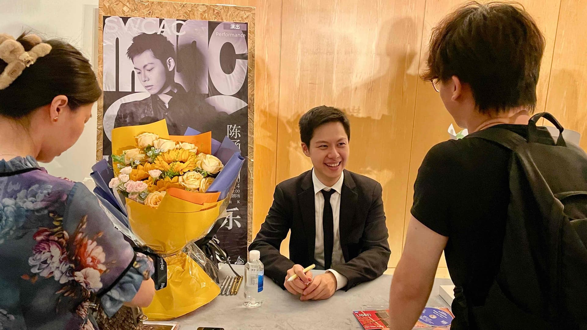 Han Chen signing CDs after concert